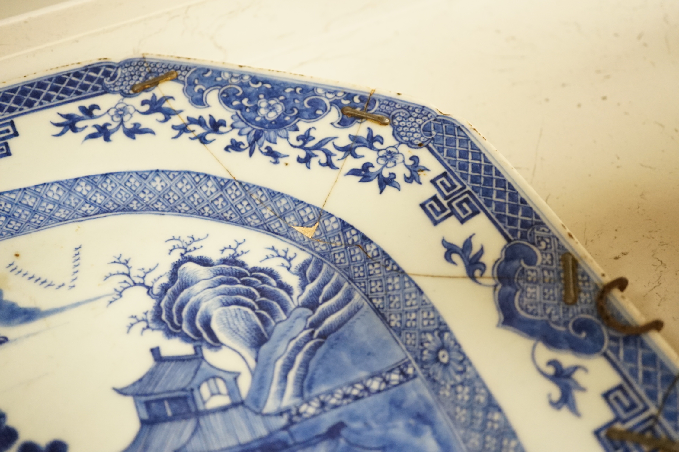 Three 18th century Chinese blue and white meat plates, largest, 41.5cm wide, 35cm deep (a.f.)